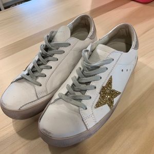 Golden goose gold star low tops